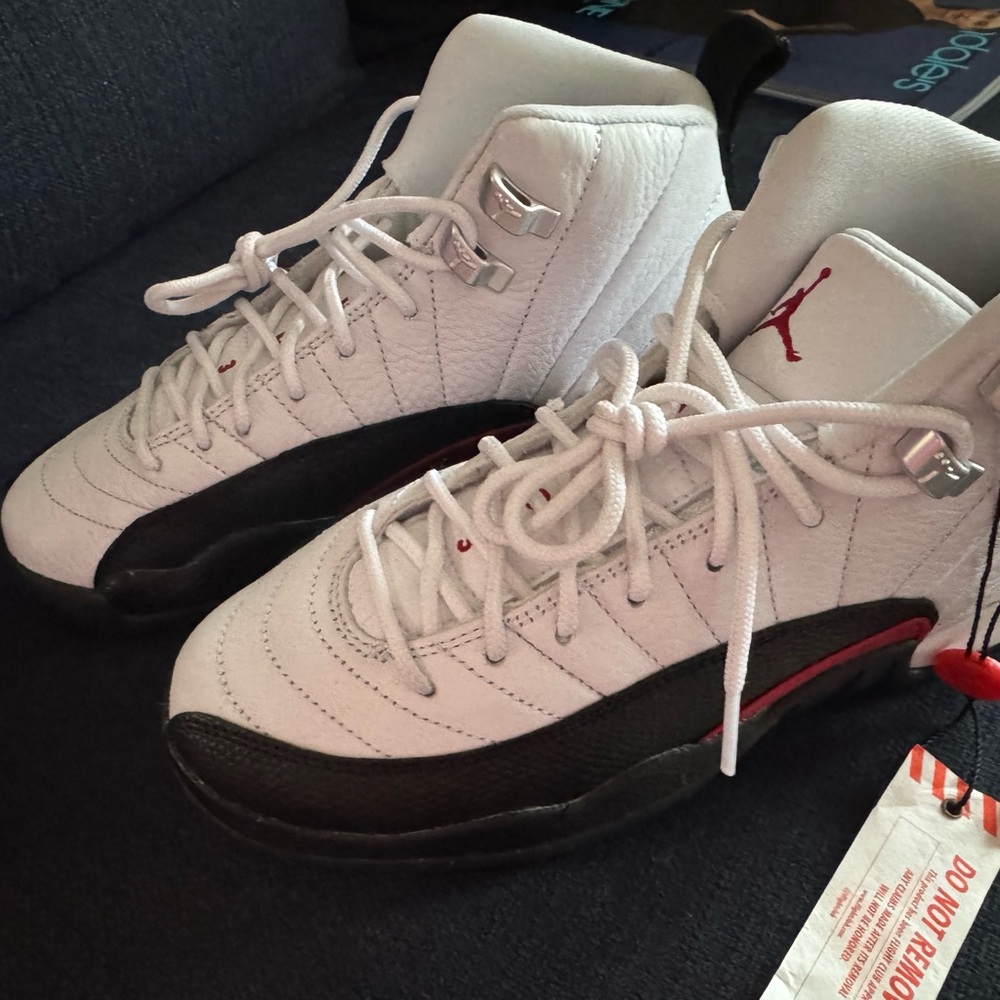 White and Black Sneakers with Red Accents